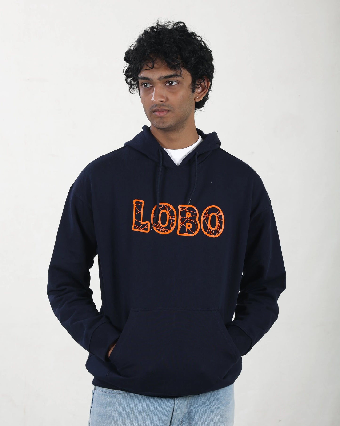 Person wearing a navy hoodie with 'LOBO' printed in orange on a white background