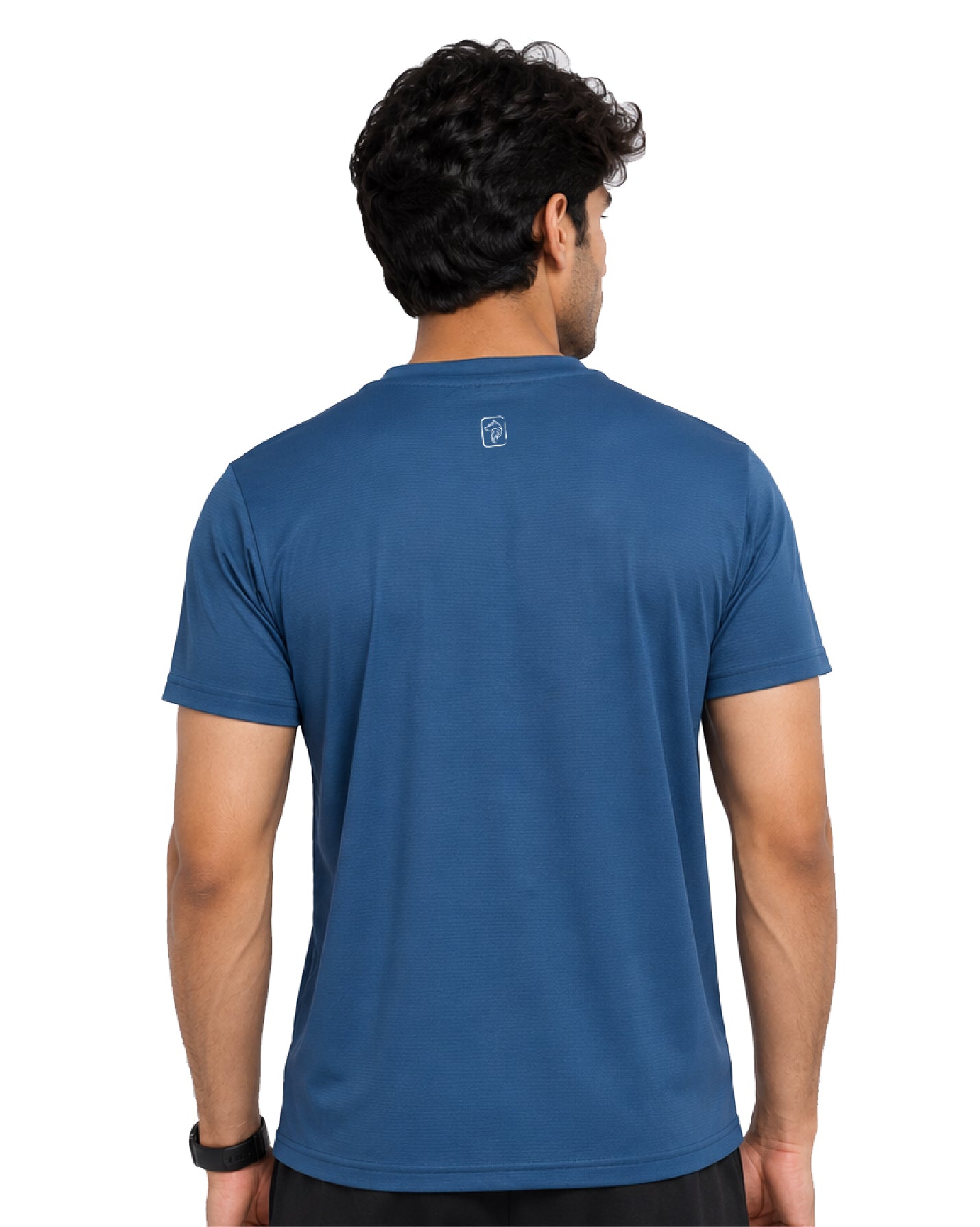 A man viewed from the back wearing a blue short-sleeve crewneck t-shirt with a small white logo on the upper back, set against a plain white background.