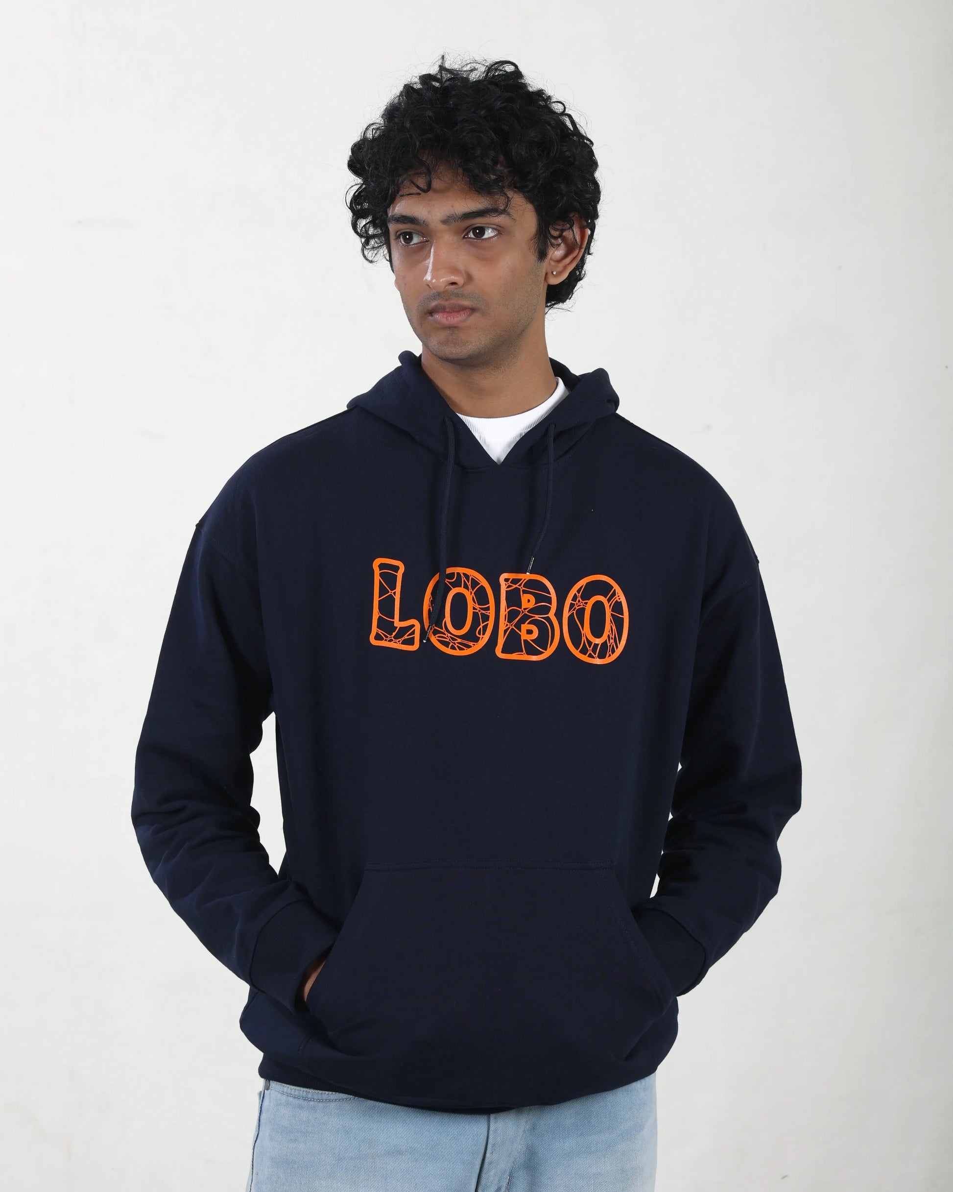 Person wearing a navy hoodie with 'LOBO' printed in orange on a white background