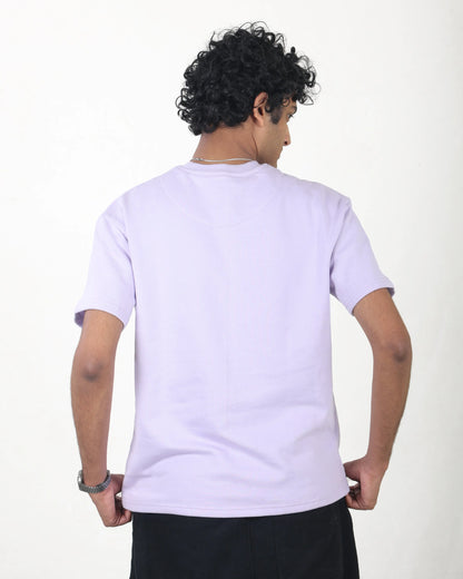 Person wearing a white t-shirt with a plain background