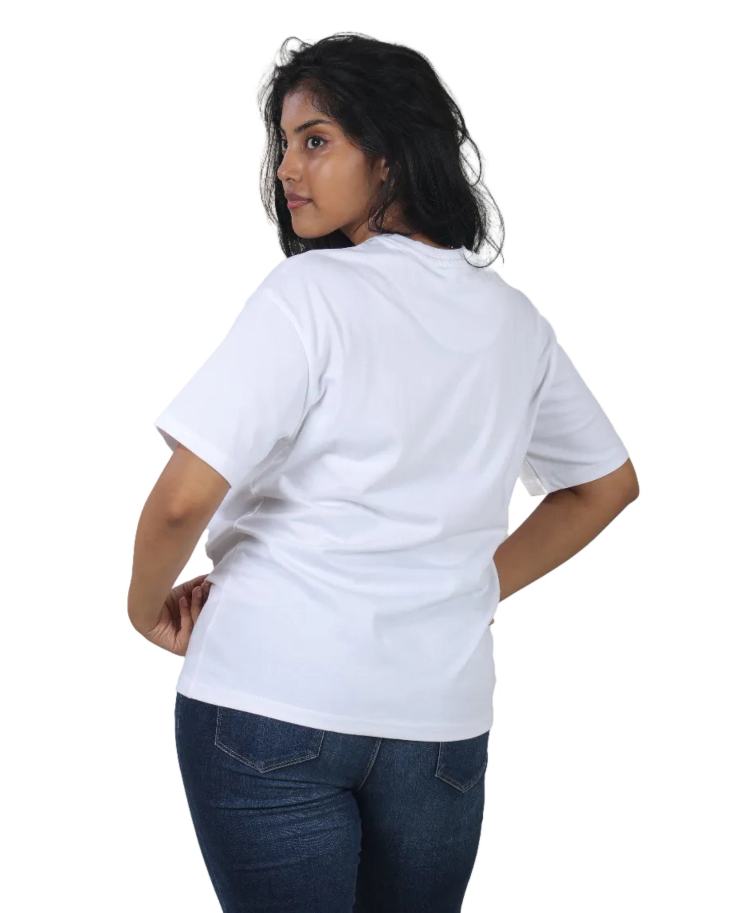 Person wearing a plain white t-shirt and dark jeans on a white background