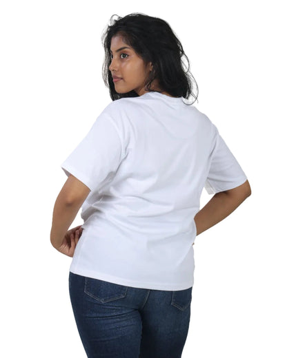 Person wearing a plain white t-shirt and blue jeans on a white background