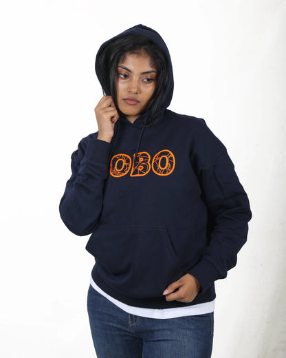 Person wearing a navy hoodie with 'OBO' printed in orange on a white background