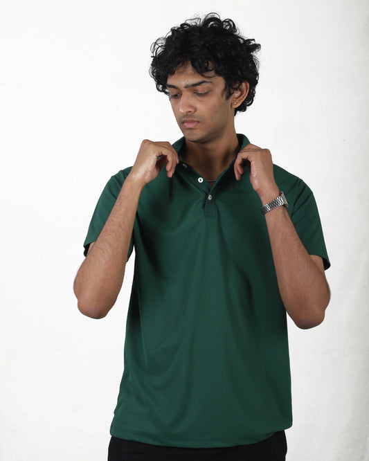 Man wearing a green polo shirt against a white background