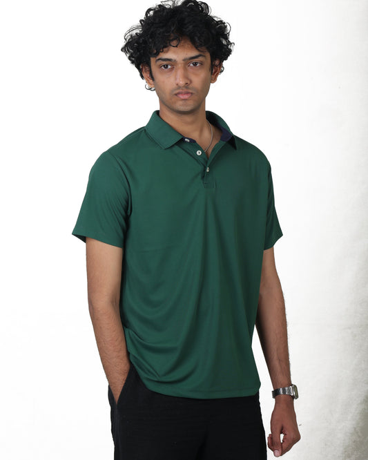 Man wearing a green polo shirt against a white background