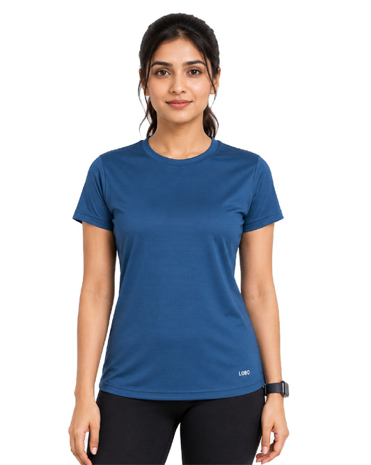 A woman modeling a short-sleeve crew-neck athletic t-shirt in a medium blue color, paired with black leggings, against a plain white background.