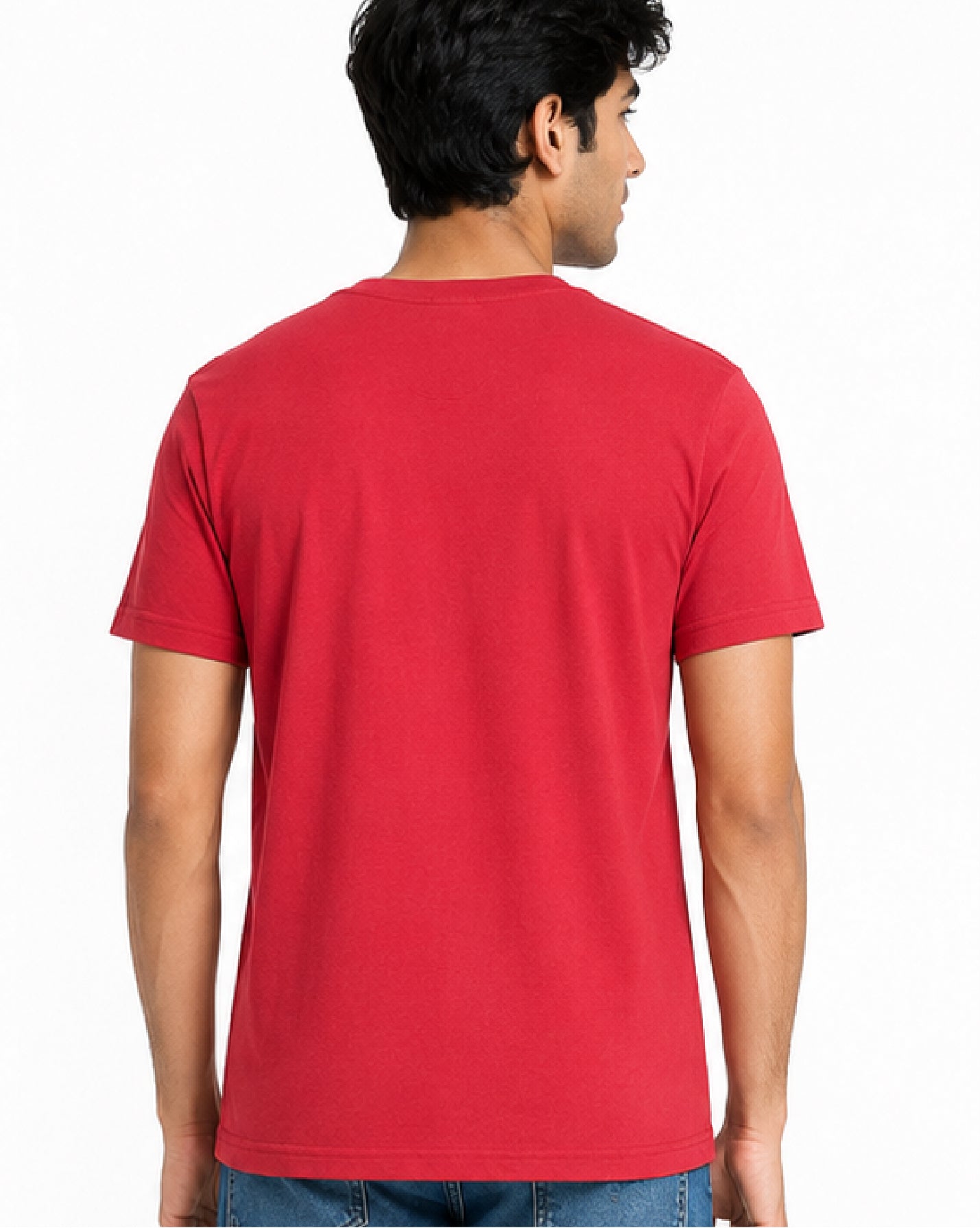 A man viewed from the back wearing a solid red short-sleeve crewneck t-shirt and blue jeans, set against a plain white studio background.