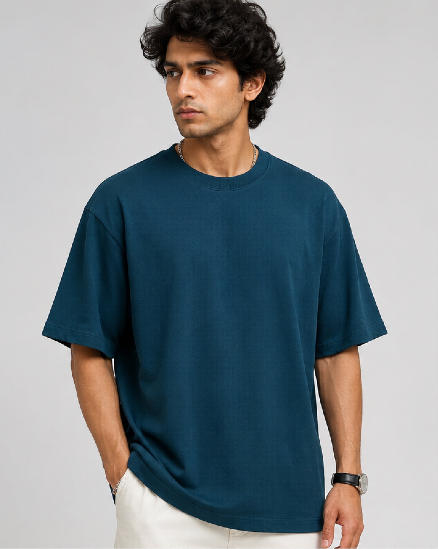 male model wearing a teal oversized tshirt front view